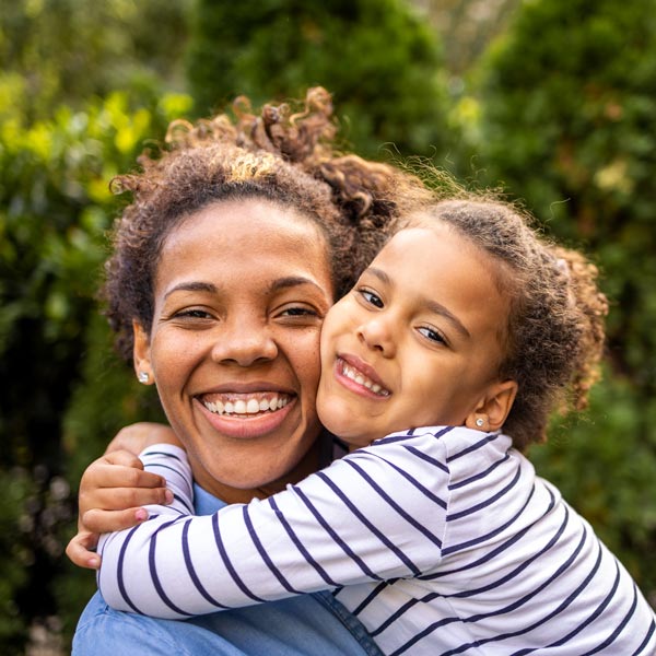 smiling mother and daughter