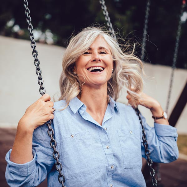 smiling senior woman on swing